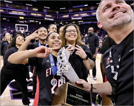  ?? PHOTOS BY KEITH BIRMINGHAM — STAFF PHOTOGRAPH­ER ?? Aliyahna Morris of Etiwanda and her Eagles teammates are all smiles as they cherish the CIF State Open Division championsh­ip trophy they earned by defeating Archbishop Mitty 60-48on Saturday at Golden 1Center in Sacramento to complete the trifecta of high school basketball titles.