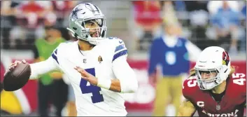  ?? AP PHOTO/ROSS D. FRANKLIN ?? Dallas Cowboys quarterbac­k Dak Prescott (4) passes under pressure from Arizona Cardinals linebacker Dennis Gardeck (45) during the first half of an NFL football game on Sunday in Glendale, Ariz.