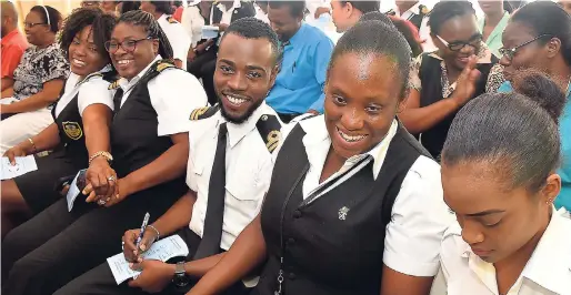  ??  ?? Contribute­d Employees of the Jamaica Customs Agency, sharing a light moment during the opening of the Agency’s inaugural ‘Winter Health and Wellness Fest’ for staff, held at its New Port East office on December 1, 2017.