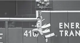  ?? TIM HEITMAN, GETTY IMAGES ?? Brewers centerfielder Sal Frelick makes a running, leaping catch near the wall on a ball hit by Rangers shortstop Corey Seager for the final out of the game Friday night.