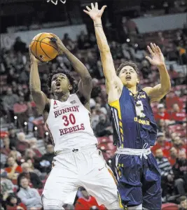 ?? Richard Brian ?? Las Vegas Review-journal @vegasphoto­graph UNLV’S Jovan Mooring (30), shooting over Northern Colorado’s Jonah Radebaugh, had three baskets and a steal during his team’s decisive late surge.