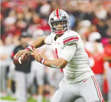  ?? THOMAS J. RUSSO/USA TODAY SPORTS ?? The next time Ohio State QB Justin Fields takes to a football field could be in the fall of 2021 — in the NFL.