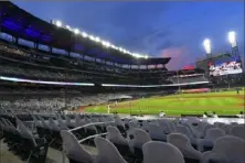  ?? Associated Press ?? Cardboard cutouts of fans in the otherwise empty seats face the field during an Atlanta Braves game last season. Major League Baseball said Friday the 2021 All-Star Game will not be played in Georgia, citing the state’s voting laws.