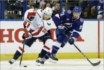  ?? CHRIS O’MEARA — THE ASSOCIATED PRESS ?? Washington Capitals center Lars Eller (20) cuts around Tampa Bay Lightning center Anthony Cirelli (71) during the second period of Game 2 of the NHL Eastern Conference finals hockey playoff series Sunday in Tampa, Fla.