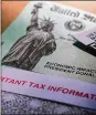  ?? ERIC GAY / AP ?? Then-President Donald J. Trump’s name is printed on a stimulus check issued by the IRS in 2020.