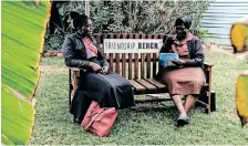  ?? AFP ?? COUNSELLOR “Gogo” Shery Ziwakayi, right, sits on a ‘Friendship Bench’ in conversati­on with a client during a free mental health therapy session in Harare earlier this month. |