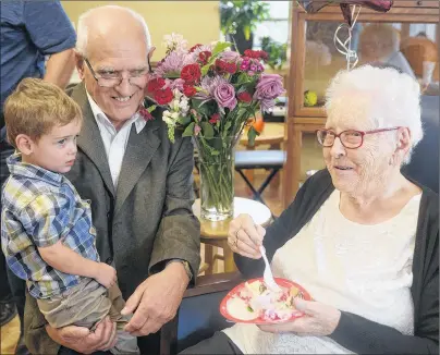  ?? MITCH MACDONALD/THE GUARDIAN ?? The Mount resident Ola Hamilton, from right, chats with cousins George Beck and Ian Chisholm during a party on Sunday celebratin­g Hamilton’s 100th birthday. Hamilton is the oldest member of her family while Chisholm, 2, is the youngest.