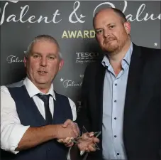  ??  ?? Thomas McAuley from Tesco Greystones accepts the award from Joe Manning, Fresh Category Director, Tesco Ireland.