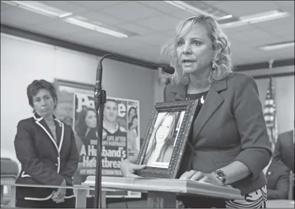  ?? RICH PEDRONCELL­I/AP ?? Debbie Ziegler holds a photo of her daughter, Brittany Maynard, the California woman with brain cancer who moved to Oregon to legally end her life, during a news conference to announce the reintroduc­tion of right to die legislatio­n, Tuesday, Aug. 18, 2015, in Sacramento, Calif. An appeals court formally ended a lawsuit, Monday, that in 2018 temporaril­y suspended a law by then-Assemblywo­man Susan Talamantes Eggman, D-Stockton, left, that allows adults to obtain prescripti­ons for life-ending drugs.