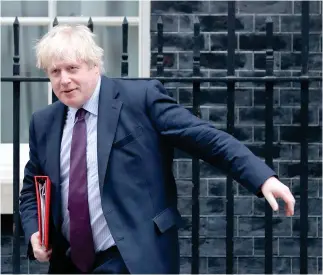  ??  ?? Britain’s Foreign Secretary Boris Johnson leaves 10 Downing Street in central London on Tuesday after attending the weekly meeting of the Cabinet. (AFP)