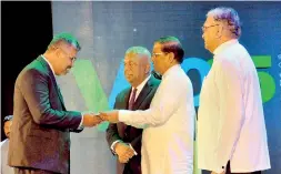  ??  ?? President Maithripal­a Sirisena and Ministers Mangala Samaraweer­a and Lakshman Kiriella are seen at the launch of the Enterprise Sri Lanka programme at the BMICH on Friday.