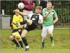  ??  ?? Neill Martin clears his lines as Stephen Morris closes in.