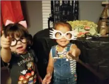  ?? SELAH HOVDA VIA AP ?? This August 2018 photo provided by Selah Hovda shows two guests practicing spells during her son’s Harry Potter-themed birthday party in Phoenix, Ariz. Hovda says the guests’ favorite part of the party was having spell battles with homemade wands.