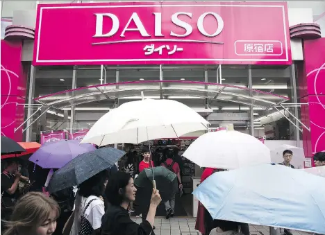  ?? TOMOHIRO OHSUMI/BLOOMBERG ?? Japanese consumers’ desire for deals has been a boon for discount retailers including Daiso. Hirotake Yano, founder and president of Daiso, credits his success to clever product sourcing, a strategy that helped Daiso’s revenue climb 6.3 per cent in...