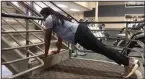 ??  ?? Emmanuel Eyiuche does the Staircase Pushup Progressio­n at Little Rock Athletic Club. (Arkansas Democrat-Gazette/Celia Storey)