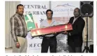  ??  ?? Pragie Reddy, left, won the A division of Central Durban Golf Club’s 39th Annual Memorial. He received the POST Papwa Putter from former editor Brijlall Ramguthee. Club president Rickey Govender looks on.