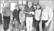  ?? Westside Eagle Observer/SUBMITTED ?? Members of the Decatur Historical Commission gathered in the train master’s office at the Decatur Depot on May 5 to accept a check from the Benton County Historical Commission for the renovation of the depot, shed and log cabin in downtown Decatur. On...