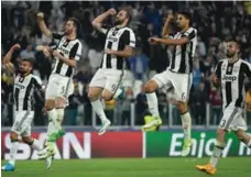  ?? MIGUEL MEDINA/AFP/GETTY IMAGES ?? Juventus jumped out to a 3-0 lead while winning the first leg of their Champions League quarter-final with Barcelona on Tuesday.