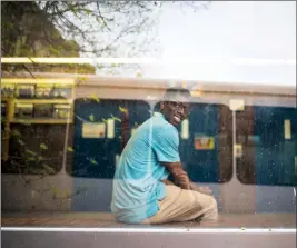  ?? Herald photo by Tijana Martin @TMartinHer­ald ?? David Awosoga sits on the window bench across from the gymnasium at what’s dubbed “Vasey Hall” at Catholic Central High School east campus on Monday after stating it’s one of his favourite places at school to hang out. “When I’m not reading, I’m...