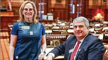  ?? NATRICE MILLER/NATRICE.MILLER@AJC.COM ?? Rep. Esther Panitch, D-Sandy Springs (left), and Rep. John Carson, R-Marietta, forged an extraordin­ary bipartisan partnershi­p to push through a measure to combat antisemiti­sm that Gov. Brian Kemp signed into law Wednesday during a ceremony at the State Capitol.