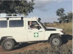  ??  ?? 0 Dr Gavin Mccoll, who helped found the Glasgow charity On Call Africa to help end poverty ten years ago, at work in a remote village in rural Zambia