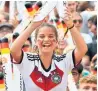  ??  ?? A supporter wears Adidas merchandis­e at the 2018 World Cup match between South Korea and Germany.