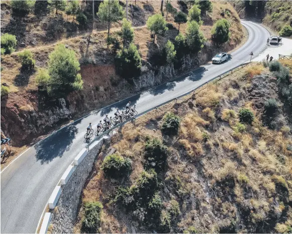  ?? Lorenzo Fizza Verdinelli ?? Clockwise from top left: The UAE Team Emirates riders at the Vuelta a Espagna; in action on the breathtaki­ng mountain terrain in Spain; Sven Erik Bystrom is congratula­ted after a second-place finish on Stage 18