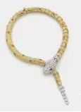  ?? ?? Bulgari, Collier Serpenti – or jaune et gris, rubis et diamants Poids : 241,53 g - Estimation : 180 000 – 250 000 €.