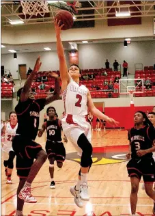  ?? PHOTO BY MIKE CAPSHAW/ ENTERPRISE-LEADER ?? Farmington’s Matt Wilson soars in for a finger roll lay-up, only to have the shot blocked by Maumelle’s Tremont Robinson (1) as he trailed the play during a Jan. 8 game.