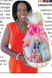  ?? CONTRIBUTE­D PHOTOS ?? SANGSTER
Joan Bucknor, owner of Joan’s Flowers & Gifts shows one of her gift items being offered this Mother’s Day.