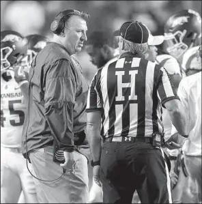  ?? NWA Democrat-Gazette/JASON IVESTER ?? Arkansas Coach Bret Bielema
talks with an official during Saturday night’s 56-3 loss at Auburn. Bielema said this week’s open date comes at a critical time for the Razorbacks. “So we’ve got to take a really serious look at some of the things we’re...