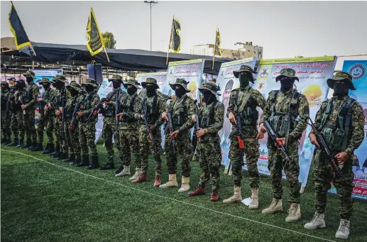  ?? (Abed Rahim Khatib/Flash90) ?? MEMBERS OF al-Quds Brigades, Islamic Jihad’s military wing, at a gathering for movement commander Khaled Mansour, slain on the first day of Operation Breaking Dawn, in Rafah, southern Gaza Strip, August 8.