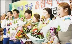  ??  ?? From right: South Korean archers Choi Mi-sun, Ki Bo-bae, Chang Hye-jin, Lee Seung-yun, Kim Woo-jin and Ku Bon-chan pose with their gold medals after returning from the Rio Olympics at the Incheon Internatio­nal Airport in Incheon, South Korea on Aug 16....