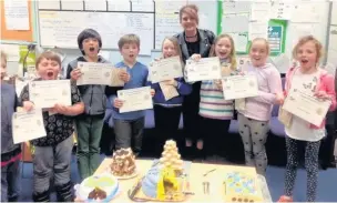  ??  ?? Some of the Bollinbroo­k Primary School pupils who took part in the charity bake off for Stand Up to Cancer