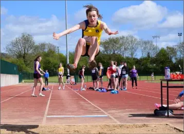  ??  ?? Aisling Kelly of Taghmon is airborne in the girls’ Under-16 long jump.