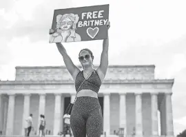  ?? KEVIN DIETSCH/ GETTY IMAGES ?? A Britney Spears supporter participat­es in a # FreeBritne­y rally at the Lincoln Memorial in Washington this month.
