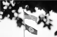  ?? — Reuters photo ?? Flags fly above the Federal Reserve building in Washington, DC.