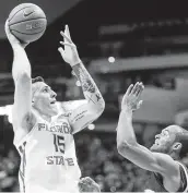  ?? Steve Cannon / Associated Press ?? Florida State’ss Dominik Olejniczak, left, scored a season-high 14 points against Boston College.