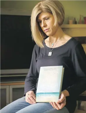  ?? ARLEN REDEKOP / POSTMEDIA NEWS ?? Tima Kurdi with her book The Boy on the Beach, a memoir about her family’s escape from Syria. “I’m still lost at sea,” she writes. “Sometimes I float ... other times I drown.”