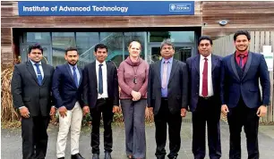  ??  ?? It’s time for a photograph after scientist M.I. Haseemdeen’s presentati­on of his work at the Oxford conference. From left are M.I. Haseemdeen (third); Dr. Helen Townley (fourth) of the University of Oxford; and Prof. Gamini Rajapakse (fifth)