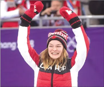  ?? THE CANADIAN PRESS/PAUL CHIASSON ?? Women's 500-metre short-track speedskati­ng bronze medalist Kim Boutin, from Sherbrooke, waves from the podium during victory ceremonies at the Pyeonchang Winter Olympics Tuesday, February 13, 2018 in Gangneung, South Korea.