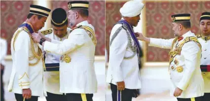  ??  ?? The King conferring the Seri Mahkota Wilayah award on MACC Deputy Chief Commission­er (Operations) Datuk Seri Azam Baki (left), and Commercial Crime Investigat­ion Department Director Datuk Seri Amar Singh Ishar Singh at Istana Negara yesterday.