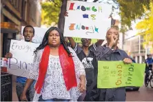  ?? YFFY YOSSIFR/STAR-TELEGRAM ?? Protesters demonstrat­ing against the killing of Atatiana Jefferson by a white Fort Worth police officer march down Main Street in Fort Worth, Texas, on Tuesday.