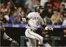  ?? David Zalubowski / Associated Press ?? Giants outfielder Steven Duggar watches his three-run triple off Colorado reliever Robert Stephenson in the fifth inning.