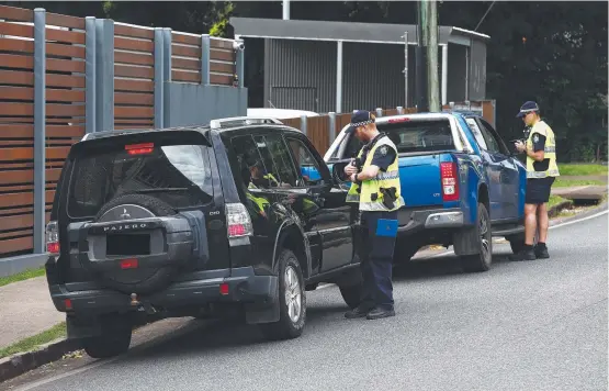  ?? ?? Police conducting traffic operatiuon­s on a Queensland street.