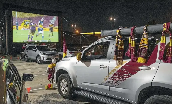  ?? GETTY IMAGES ?? The NRL is back, but not as we know it. Suncorp Stadium in Brisbane was empty as Parramatta easily beat Brisbane, forcing some Broncos fans to watch the game from a pop-up drive-in.