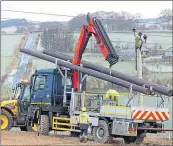  ?? ?? Engineers repair power lines near Strichen