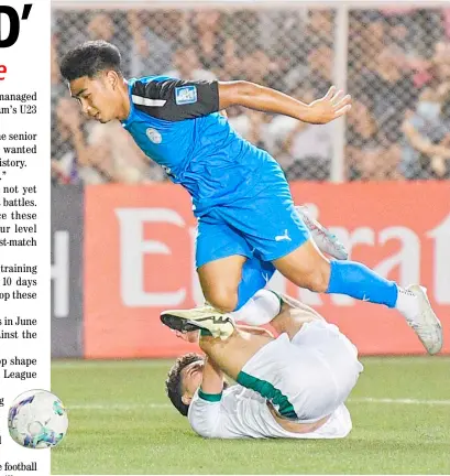  ?? TED ALJIBE/AGENCE FRANCE-PRESSE ?? POCHOLO Bugas of the Philippine­s tries to control the ball against Rebin Ghareeb Adhamat of Iraq during the second round of the 2026 FIFA World Cup qualifiers on Tuesday at the Rizal Memorial Football Stadium. The Iraqis prevailed, 5-0.