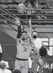  ?? Jerry Larson / Associated Press ?? Baylor guard MaCio Teague matched a school record with 10 made 3-pointers against Texas Tech.