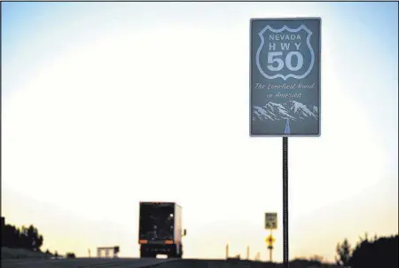  ?? DAVID BECKER/LASVEGASRE­VIEW-JOURNAL FOLLOW@DAVIDJAYBE­CKER ?? A truck sets off to travel westbound along U.S. Highway 50, “The Loneliest Road in America,” from Eureka on July 12.